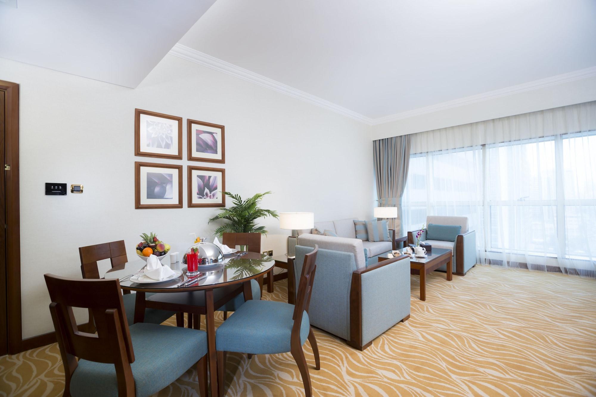 Grand Mercure Majlis Residences Abu Zabi Zewnętrze zdjęcie A living room at the hotel